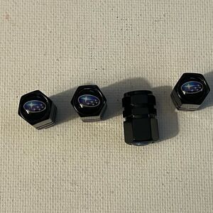 Subaru logo valve Stem caps in black set of 4 NWT